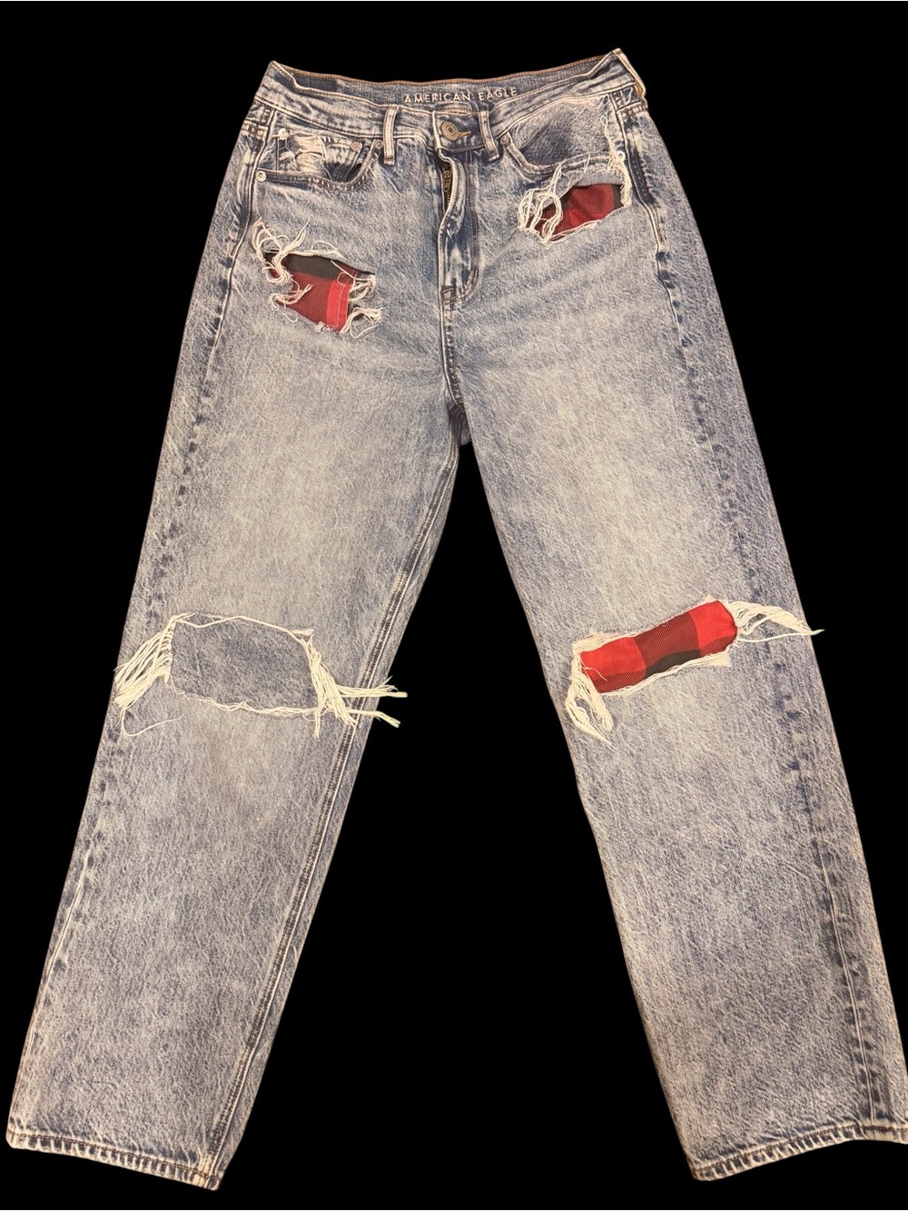 American Eagle Outfitters Distressed Light Wash Jeans with Red Patch Detail